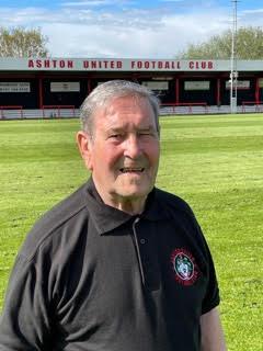 One of our adventurers, Ronny, at Ashton United Football Club in his Ashton United shirt