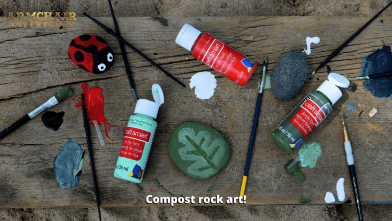 Image of paints, paintbrushes and painted rocks